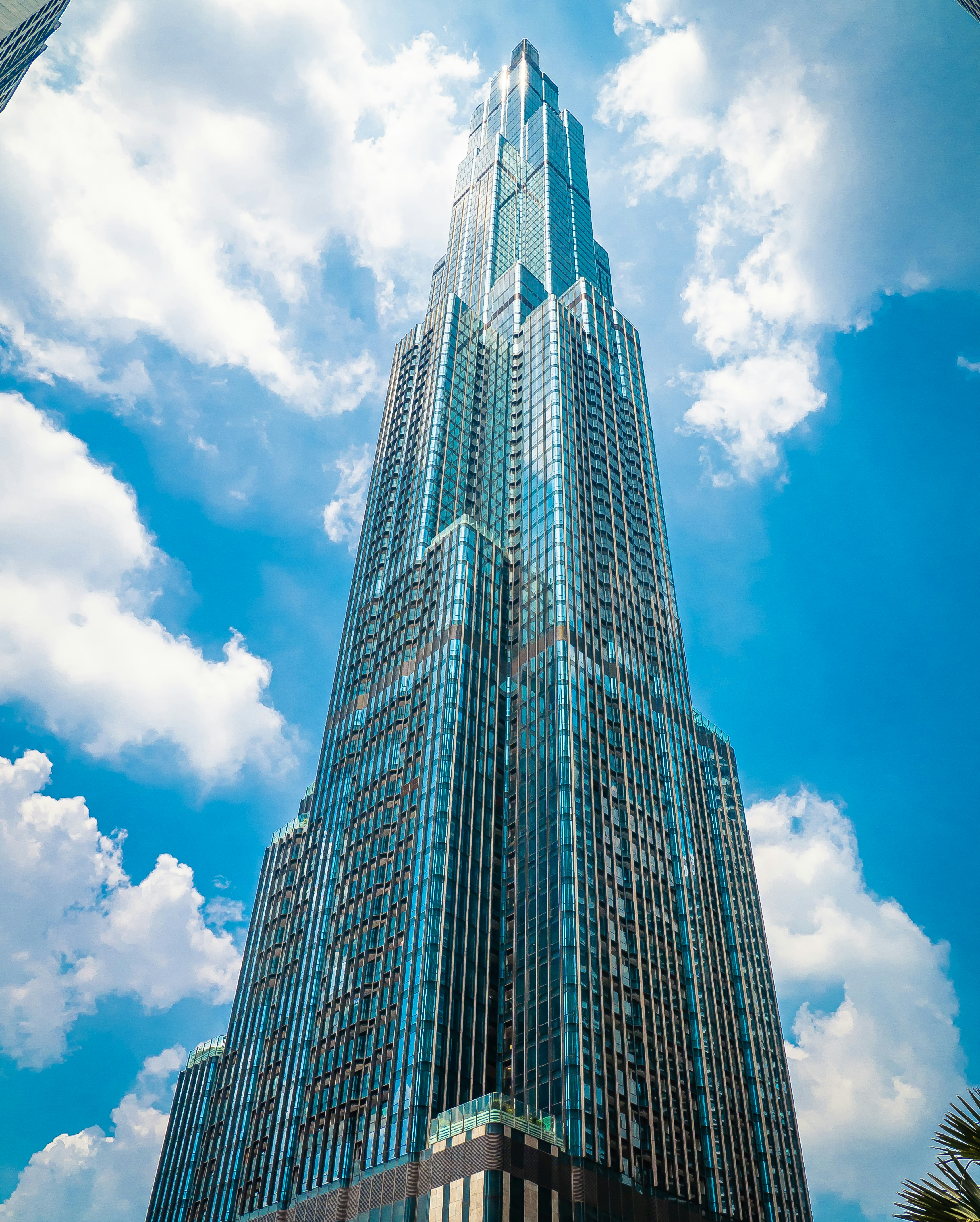 A skyscraper tower rising into the clouds — the towering incumbent Goliath.